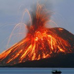 Volcano erupting along seacoast.